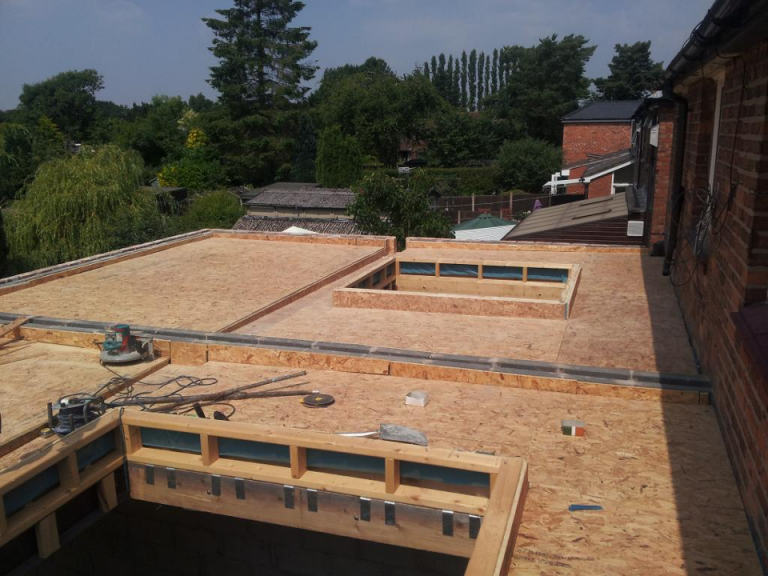 Flat roof boarded with OSB before applying GRP fibre glass