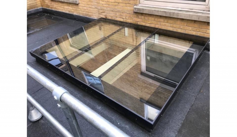 Flat glass roof skylights installed on flat roof