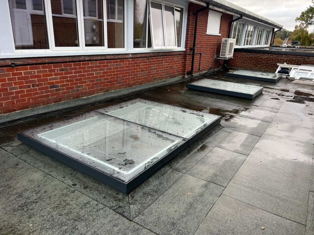 Flat roof skylight window installation at Long Stratton High School