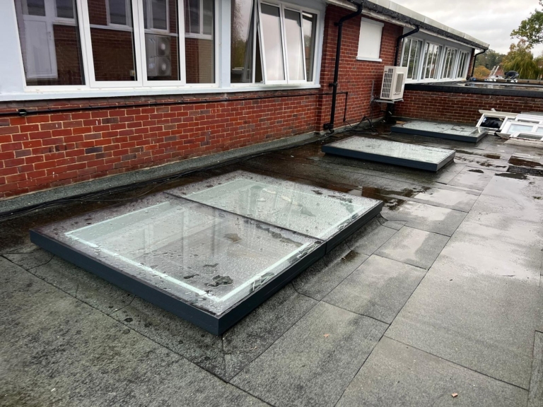 Flat roof skylight window installation at Long Stratton High School