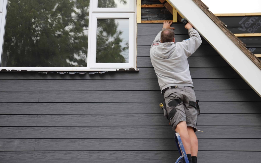Cladding being repaired by one of our roofers