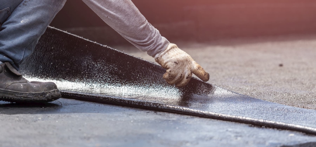 Flat felt roof being repaired