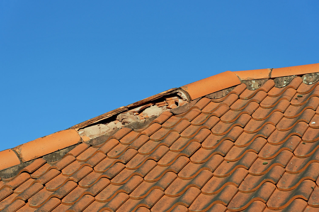 Broken ridge tile on house that needs repairing