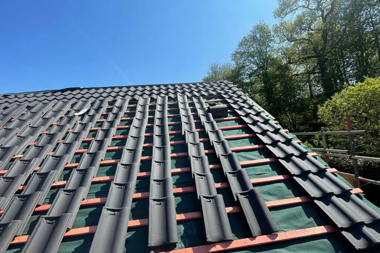 A pitched roof replacement job being completed by our team