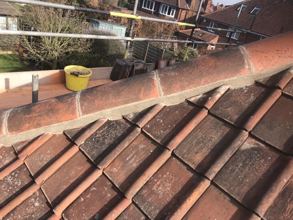 Ridge tiles installed using cement