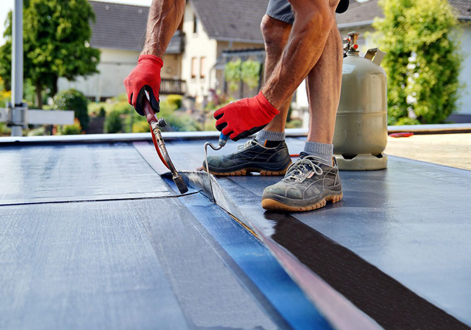 Torch on felt flat roofing being repaired in Norwich