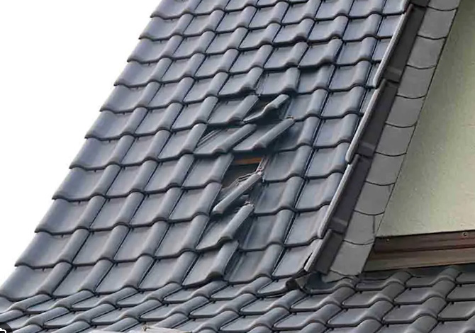Tiles on a roof out of position needing repairing